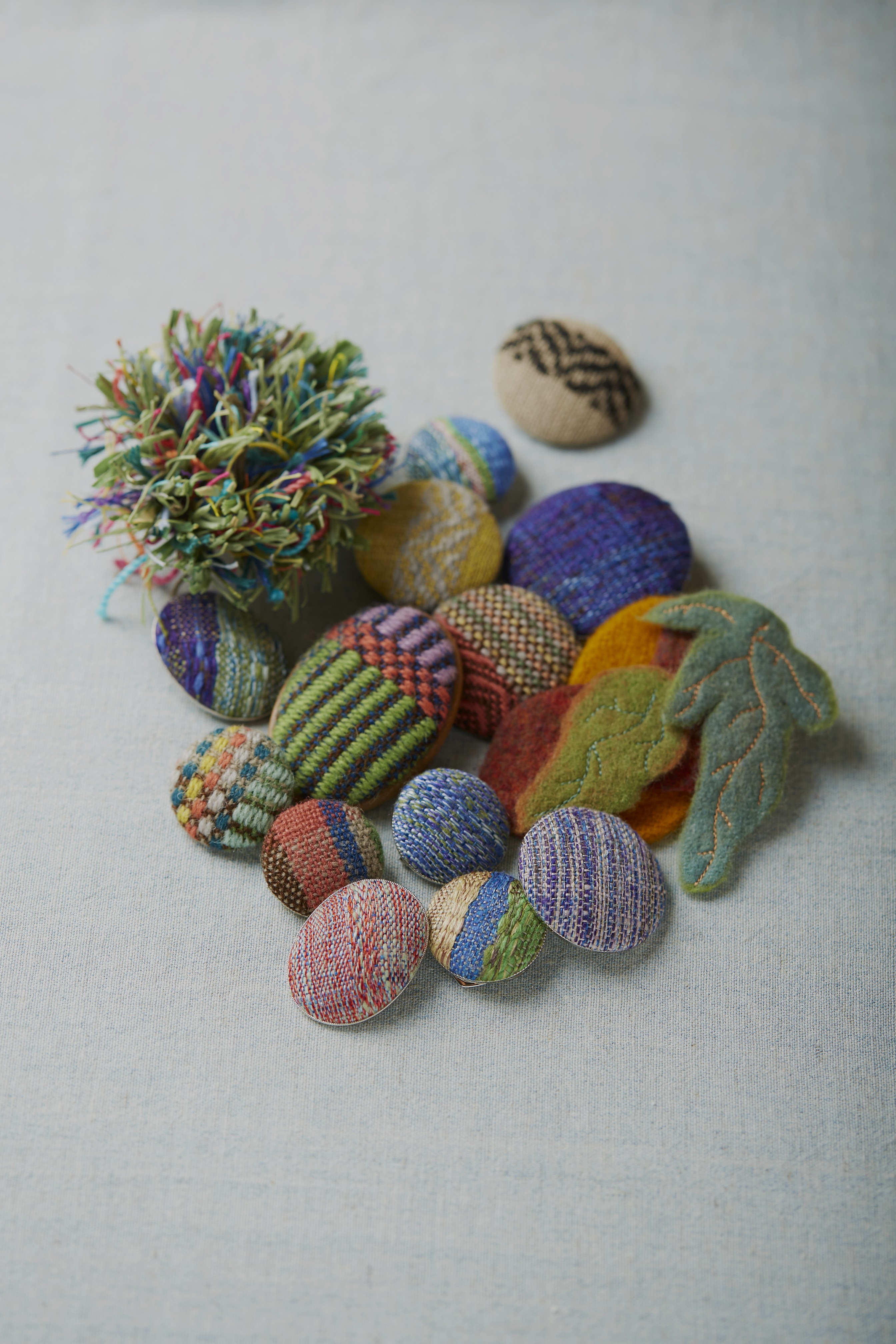 Hand woven brooches
